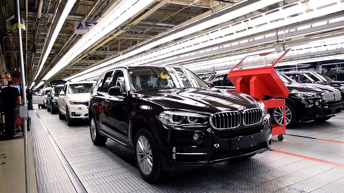 In this file photo, BMW X5 vehicles roll off the assembly line at the BMW manufacturing facility in Spartanburg.