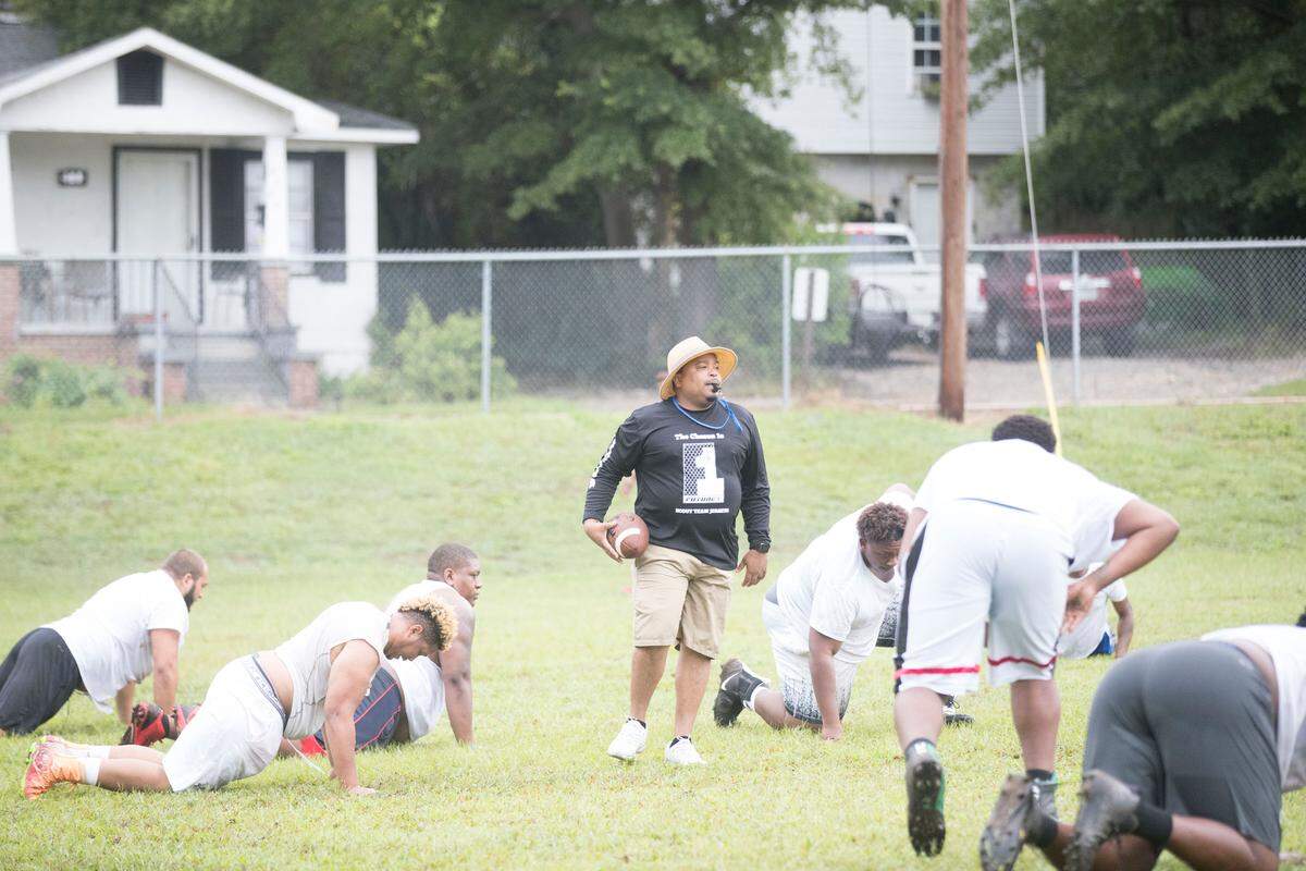 Allen University’s head football coach Ted Keaton blows a whistle for his players to do up-downs during practice at Carver-Lyon Elementary School in Columbia, SC.