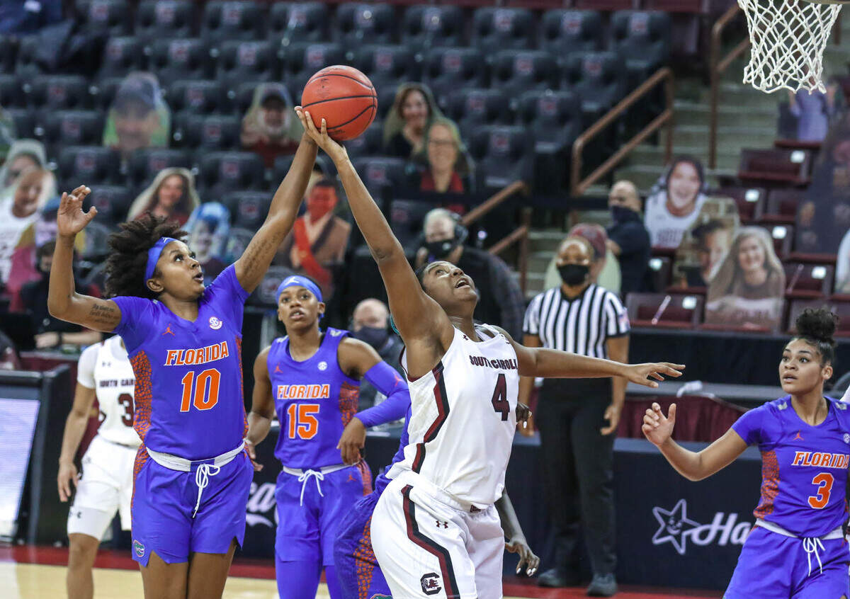 South Carolina Gamecocks forward Aliyah Boston (4) snags a rebound from Florida guard Danielle Rainey (10) during the first half of action in the Colonial Life Arena.