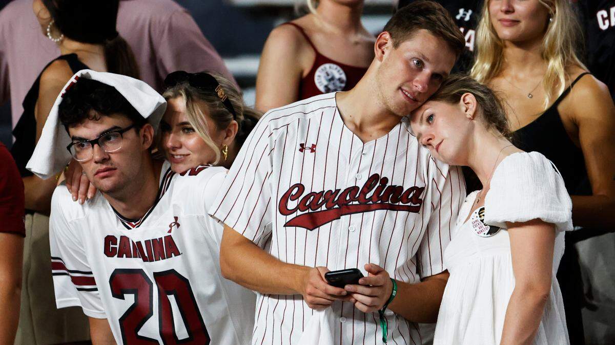 South Carolina fans lean on one another as their team plays Georgia State at Williams-Brice Stadium in Columbia, SC on Saturday, Sept. 3, 2022.