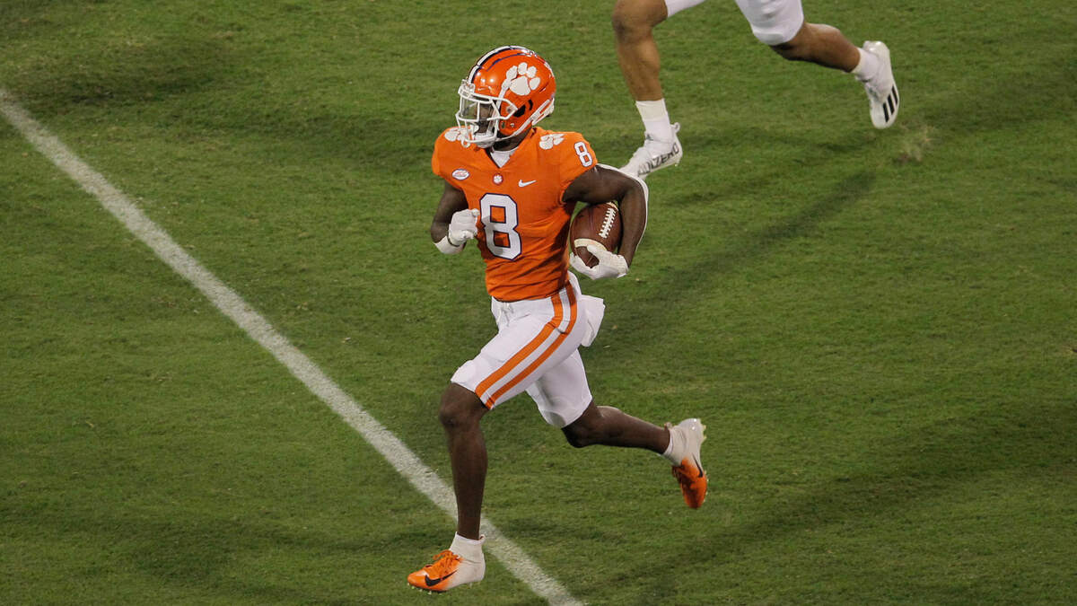 Clemson wide receiver Justyn Ross (8) breaks away from Boston College defensive back Jaiden Woodbey (9) for a big gain on the first play of the game in Clemson, S.C. on Saturday, Oct. 2, 2021. (Travis Bell/SIDELINE CAROLINA)