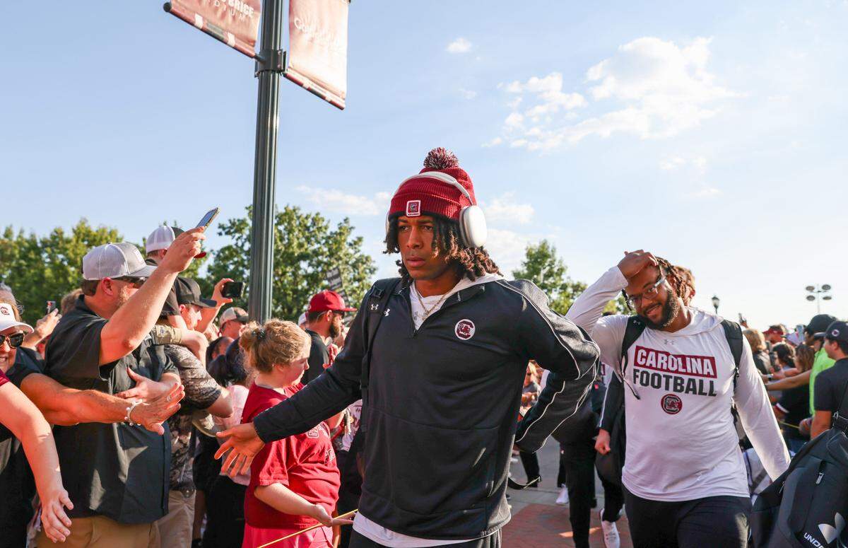 South Carolina quarterback Robby Ashford (1) is greeted by fans during the Gamecock Walk before South Carolina’s game against Akron in Columbia on Saturday, September 21, 2024.