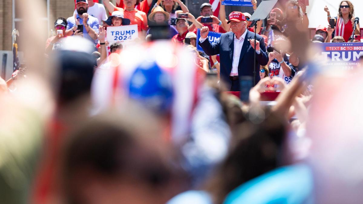 Former President Donald Trump dances while leaving the stage during a campaign event in Pickens, South Carolina on Saturday, July 1, 2023.