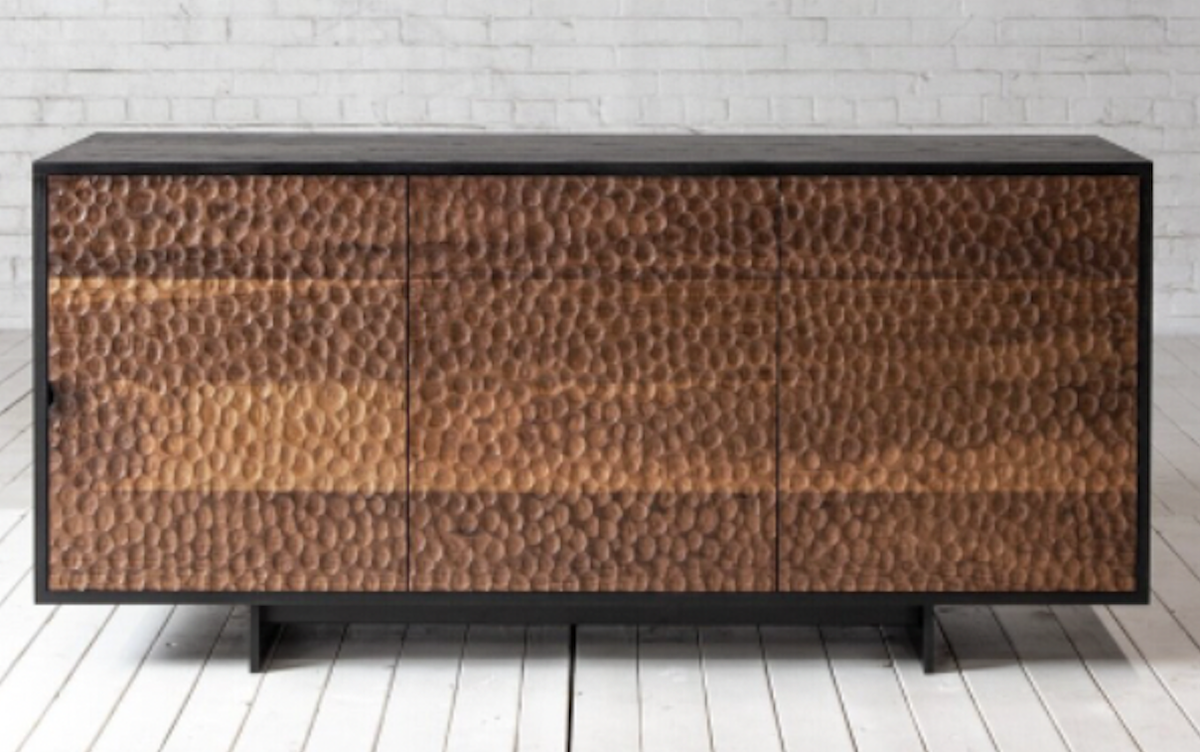 Josh Cox hand carves the fronts of each Mobley credenza.