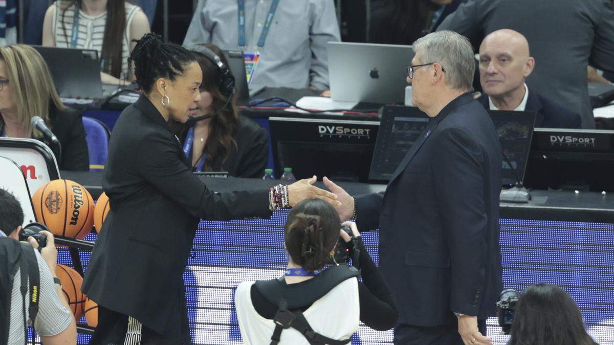 South Carolina's head coach Dawn Staley and University of Connecticut’s head coach Geno Auriemma greet before their women's basketball game in the NCAA Tournament semifinals at Mortgage Matchup Center in Phoenix on Friday, April 3, 2026. 