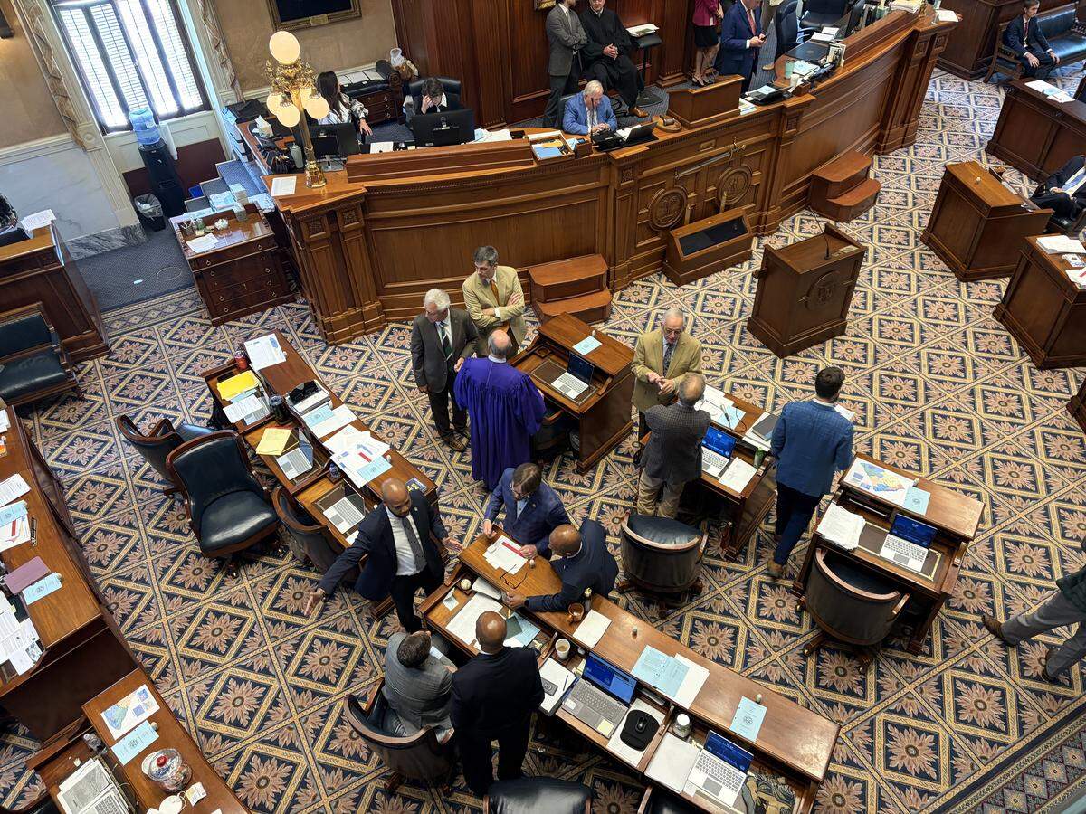 South Carolina senators huddle during a brief recess ahead of redistricting debate Friday, May 22, 2026.