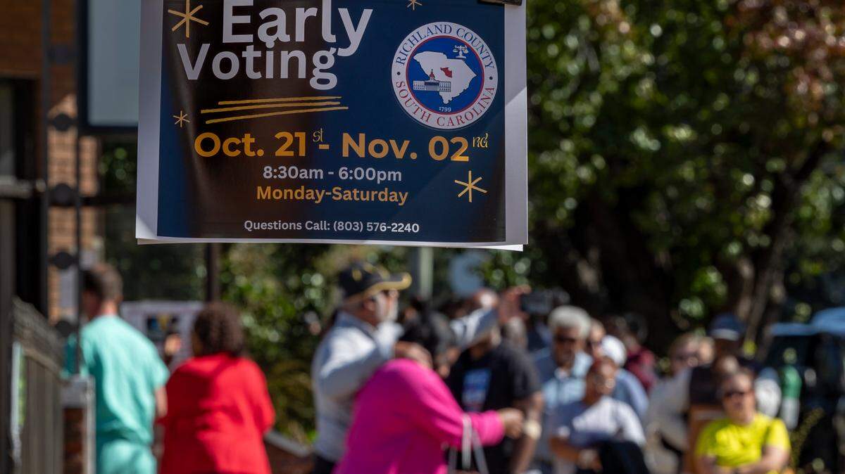 Voters stand in line outside an early voting center on Hampton Street in Columbia on the first day of early voting on Monday, Oct. 21, 2024.