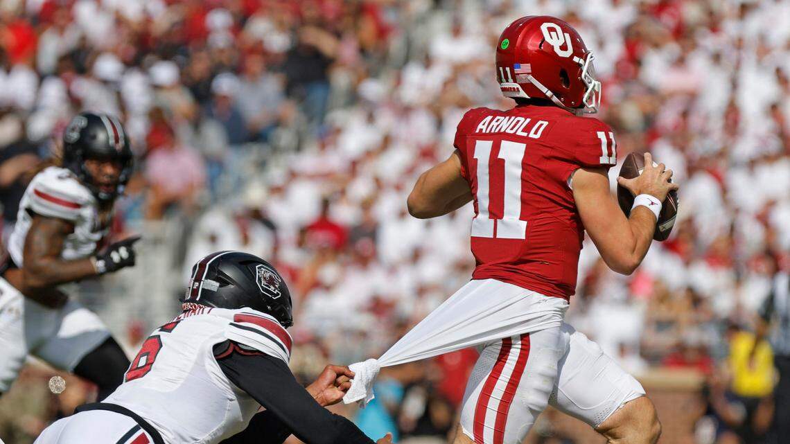 South Carolina’s Dylan Stewart (6) tries to pull down Oklahoma’s Jackson Arnold in the first quarter, Saturday, Oct. 19, 2024, at Gaylord Family - Oklahoma Memorial Stadium in Norman, Okla.