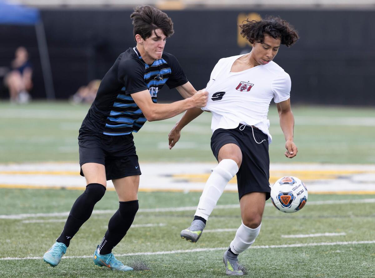 Alex Rivera of Brookland-Cayce High School battles for a loose ball with Eddie Merck of Daniel High School during the SCHSL Class 3A Boys Soccer State Championship on Friday.