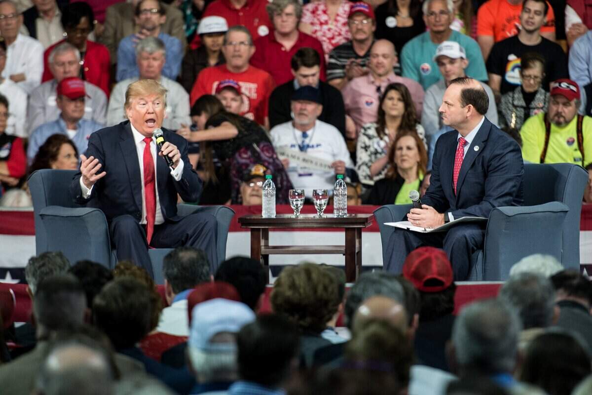 AIKEN, SC - DECEMBER 12: Republican presidential candidate Donald Trump (L) speaks to the crowd as South Carolina Attorney General Alan Wilson moderates at a town hall meeting December 12, 2015 in Aiken, South Carolina. The South Carolina Republican primary is scheduled for February 20, 2016. (Photo by Sean Rayford/Getty Images)