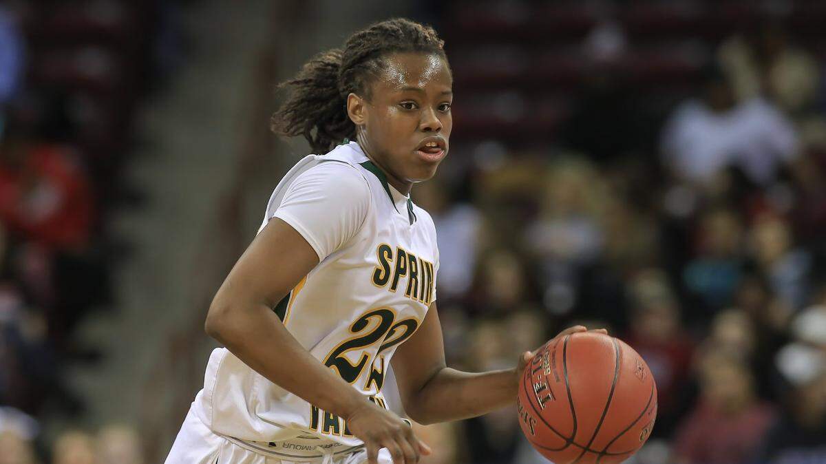 Spring Valley guard Megan Davis brings the ball up court during the first quarter of the State Championship Friday at Colonial Life Arena. on March 6, 2015.