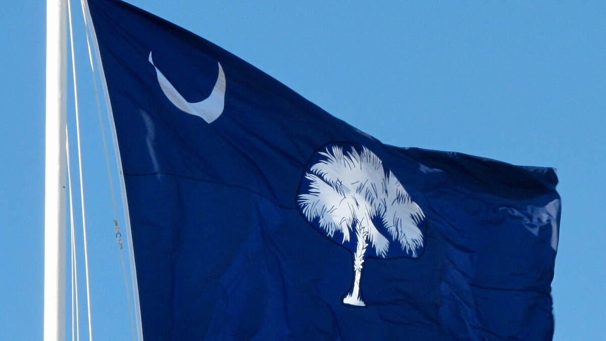 The South Carolina flag adopted in 1861 by the General Assembly after South Carolina seceded from the Union in flies over Fort Moultrie on Sullivans Island, S.C., on Friday, Jan. 28, 2011, the 150th anniversary of the flag’s adoption. The crescent on the flag points up, rather than at an angle as the current state flag. (AP Photo/Bruce Smith)