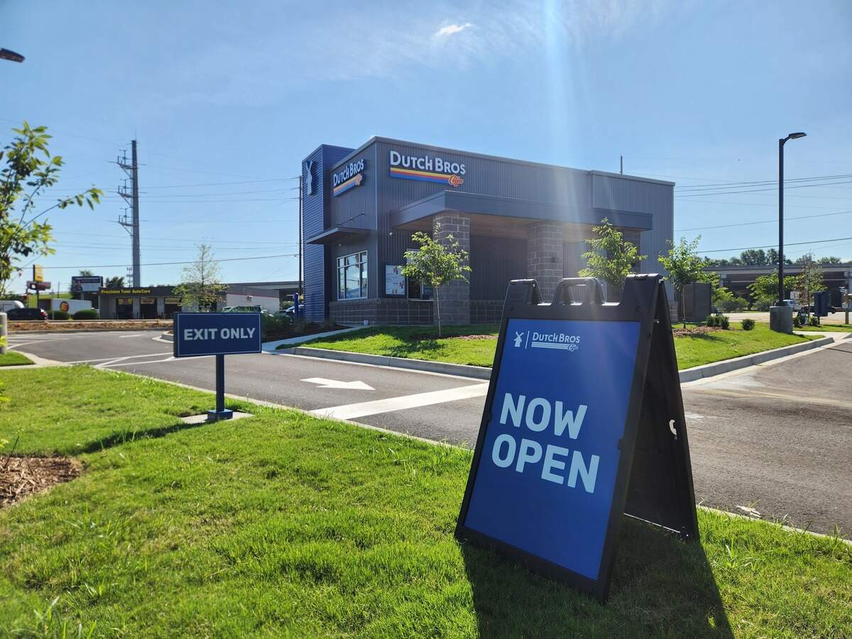 A sign, photographed on June 22, 2026, notes that the Dutch Bros Coffee location at 7001 Garners Ferry Road is now open.