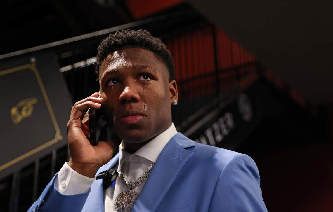 Gregory “GG” Jackson tears up while talking on the phone after being drafted during his NBA Draft party, held at the Cockaboose Club at Williams-Brice Stadium.
