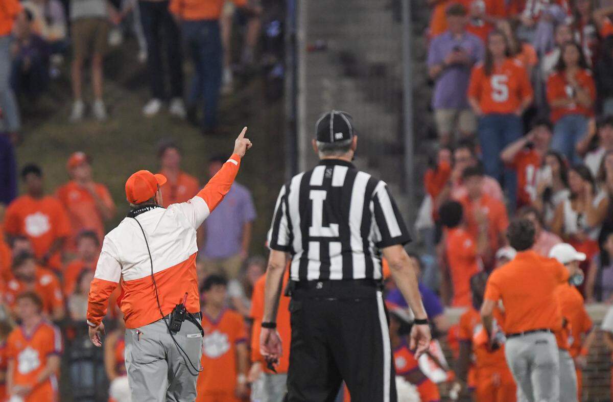Nov 2, 2024; Clemson, South Carolina, USA; Clemson Tigers head coach Dabo Swinney reacts after people in the stands threw water bottles on the field after a call in favor of the Louisville Cardinals during the fourth quarter at Memorial Stadium.