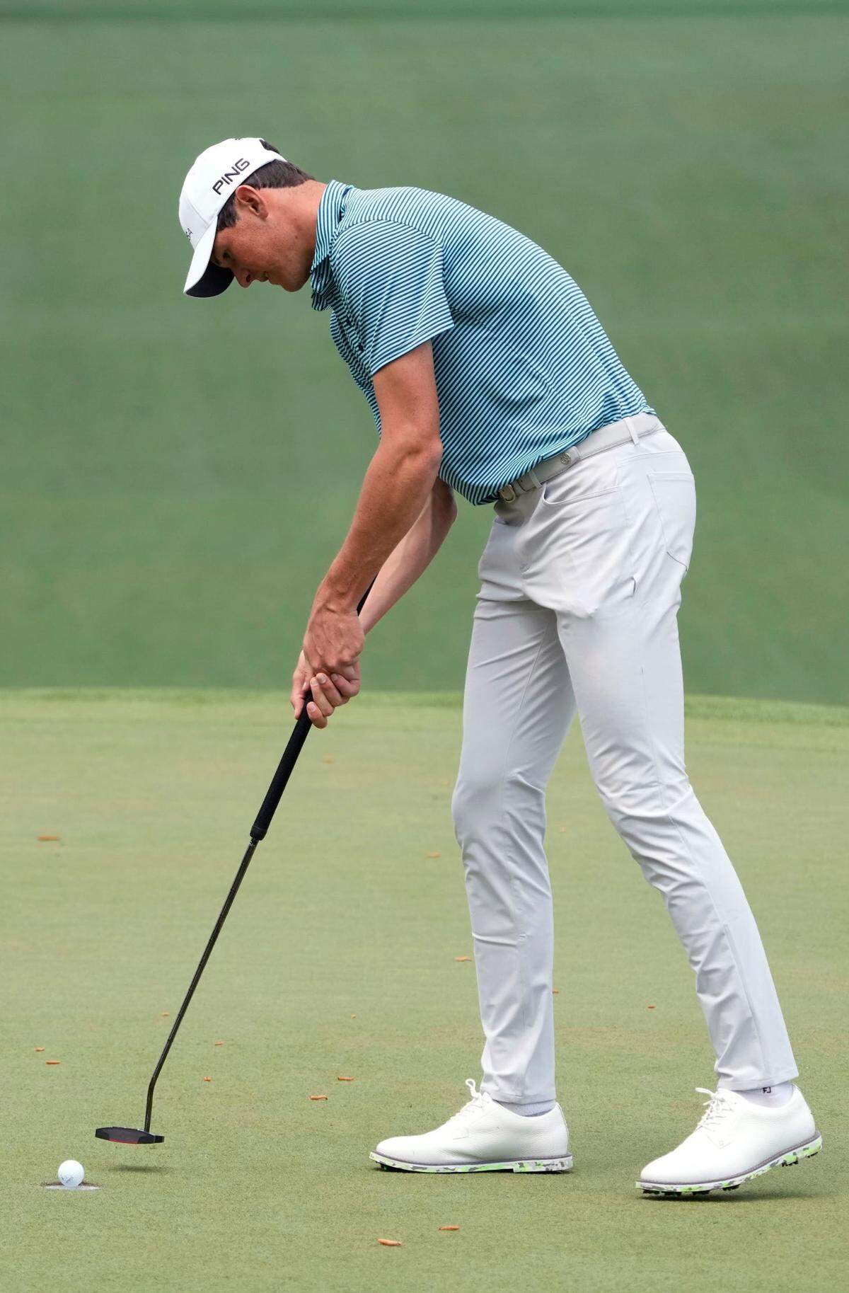 Apr 11, 2024; Augusta, Georgia, USA; Christo Lamprecht putts on the seventh green during the first round of the Masters Tournament. Mandatory Credit: Michael Madrid-USA TODAY Network