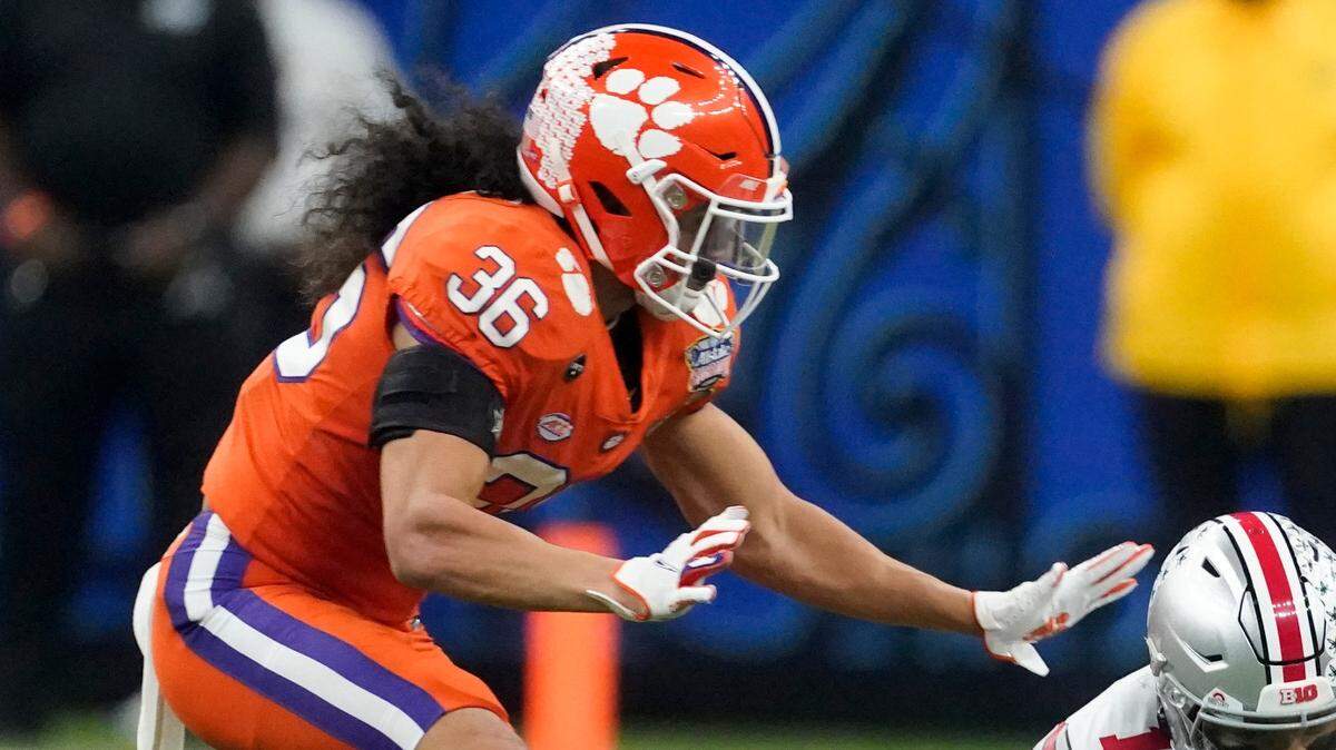 Ohio State quarterback Justin Fields is tackled by Clemson safety Lannden Zanders during the first half of the Sugar Bowl NCAA college football game Friday, Jan. 1, 2021, in New Orleans. (AP Photo/John Bazemore)