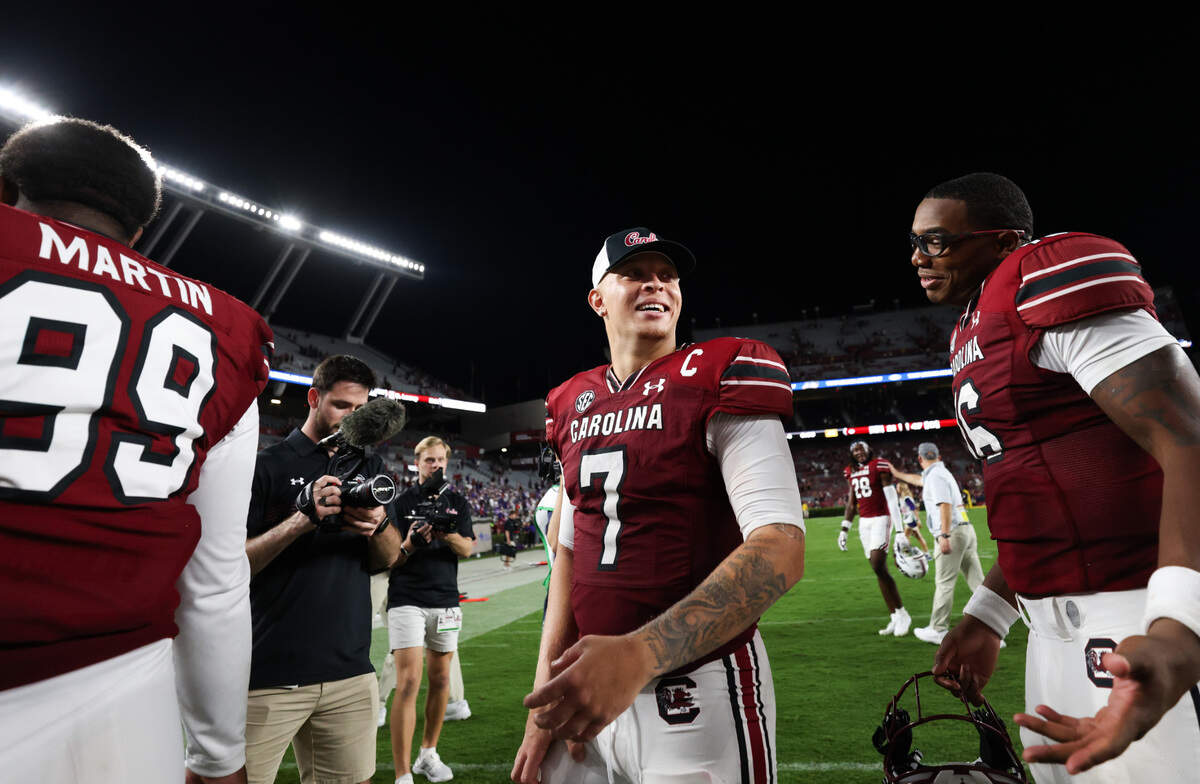 South Carolina quarterback Spencer Rattler (7) speaks with fellow quarterback quarterback LaNorris Sellers (16) following the Gamecocks’ game against Furman at Williams-Brice Stadium in Columbia on Saturday, September 9, 2023.