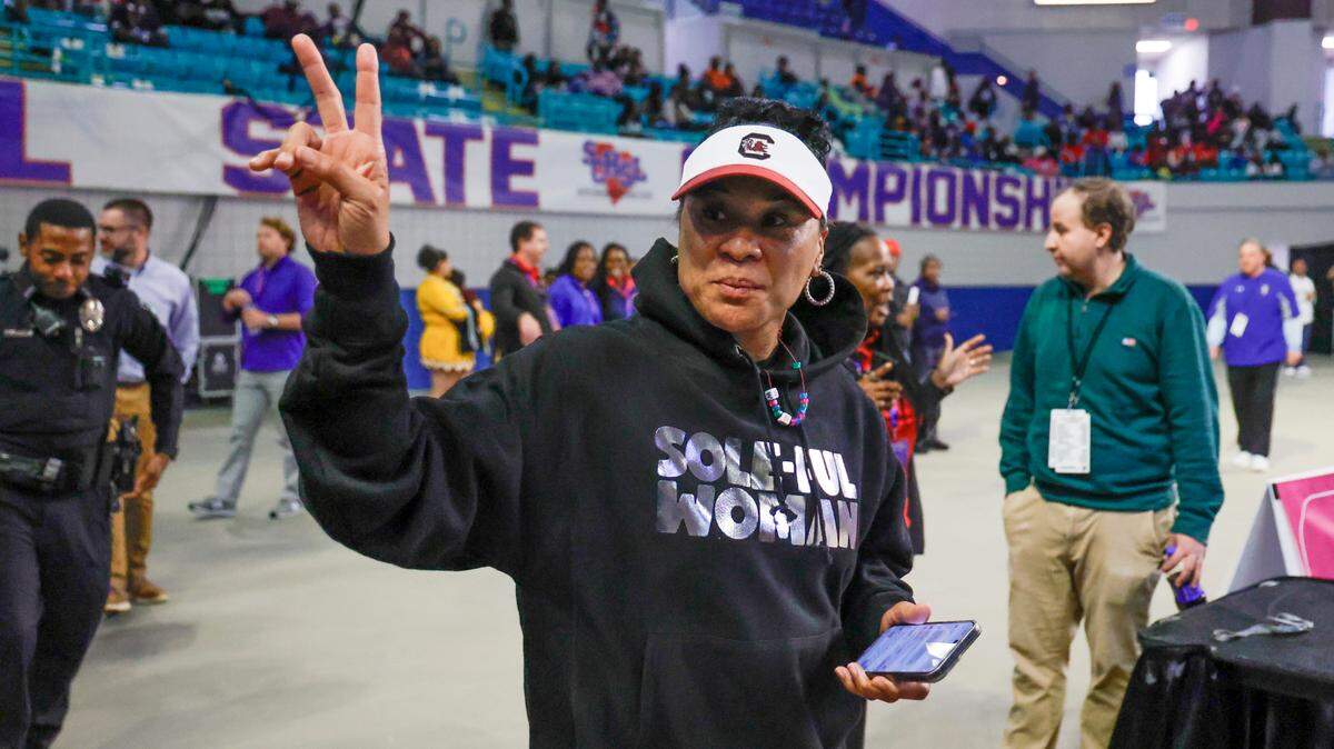 University of South Carolina Head Coach Dawn Staley acknowledges the fans as she arrives at the South Carolina High School girls 3A basketball game in Florenceon Saturday, March. 2, 2024.