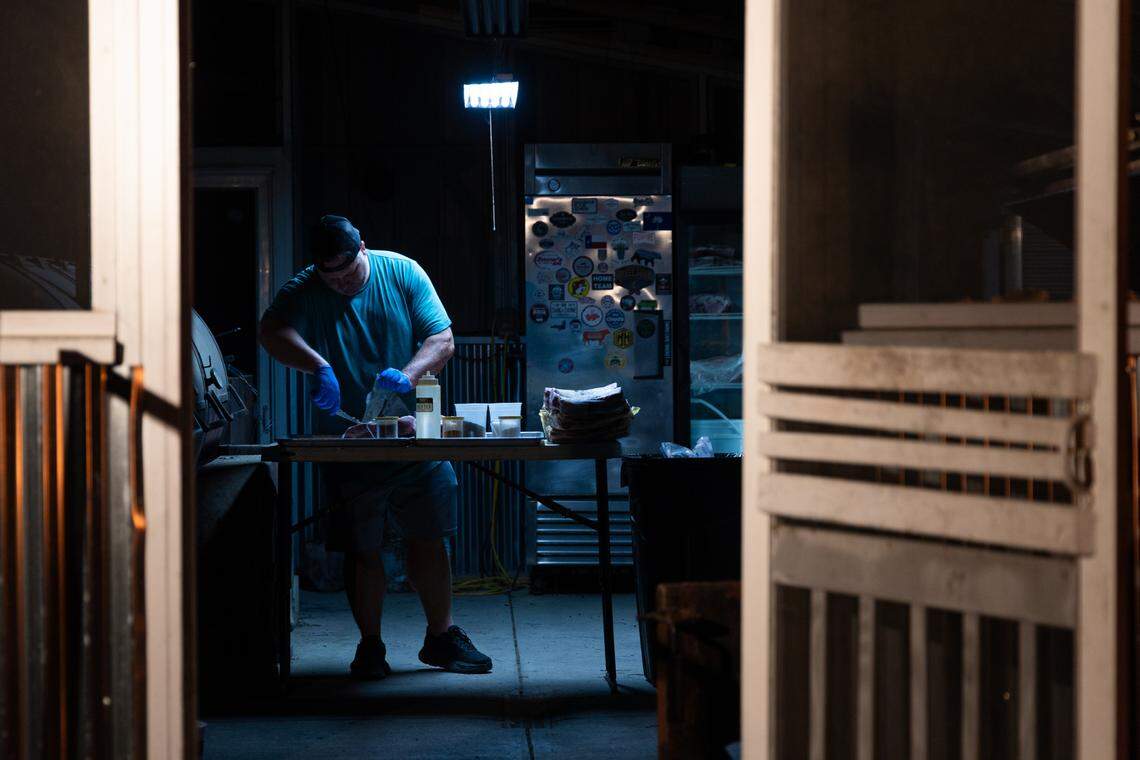 Julian Levkoff prepares beef ribs at City Limits Barbeque in West Columbia before dawn on Friday, March 28, 2025. Levkoff has worked with restaurant owner Robbie Robinson for seven years.