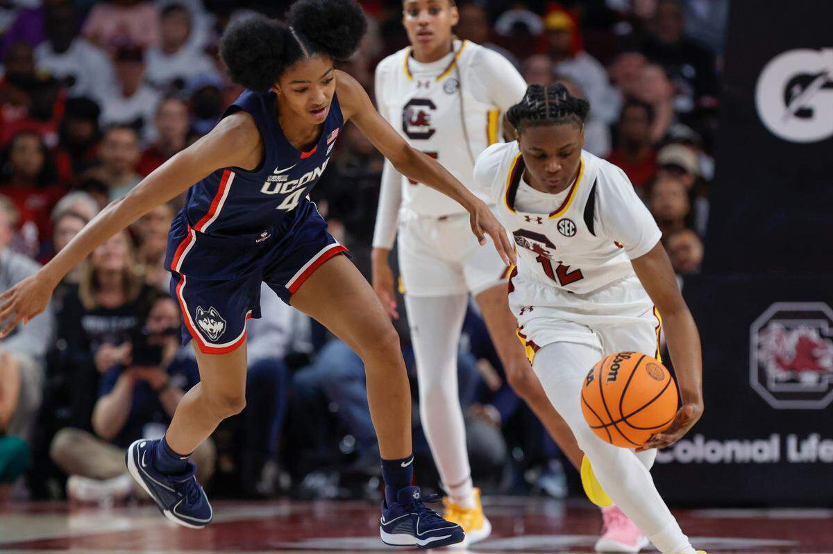 South Carolina’s MaLaysia Fulwiley (12) snags the ball from University of Connecticut’s Qadence Samuels (4) during the second half of action in the Colonial Life Arena on Sunday, Feb. 11, 2024