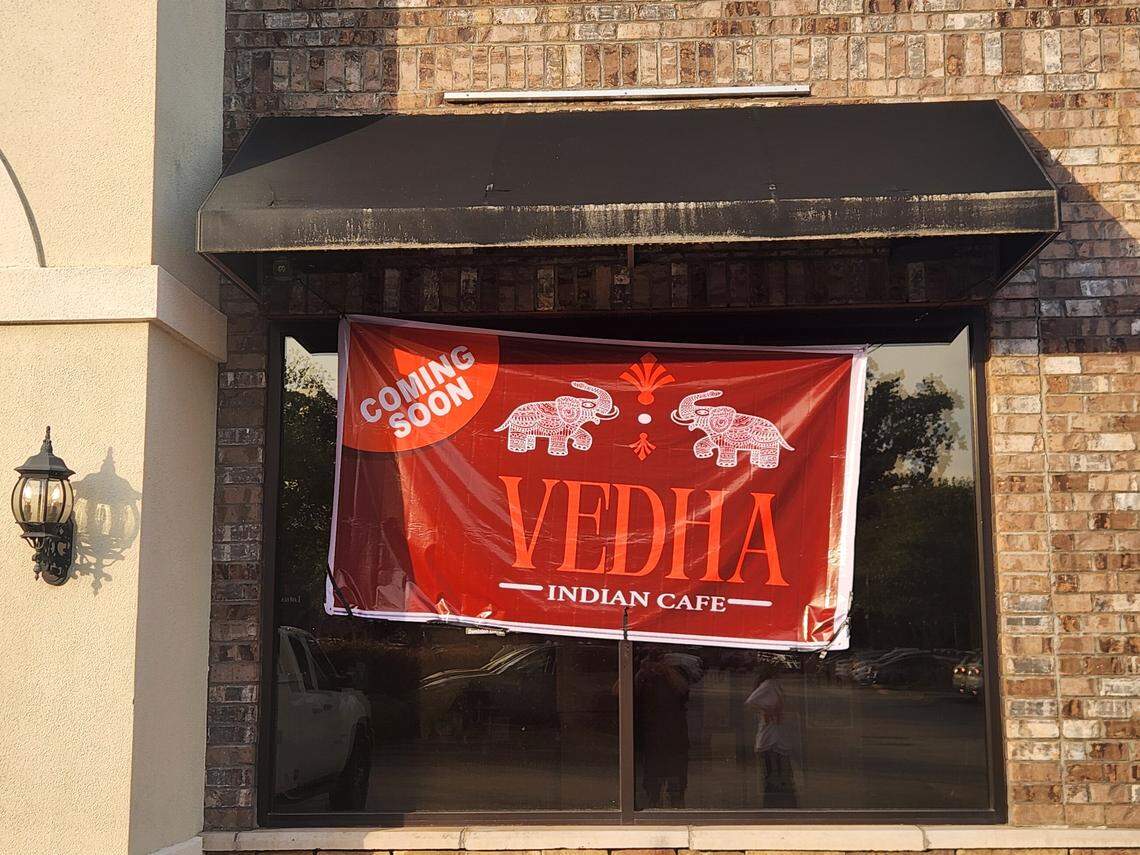 A banner notes that Vedha Indian cafe is coming soon at 5076 Sunset Blvd. in Lexington.