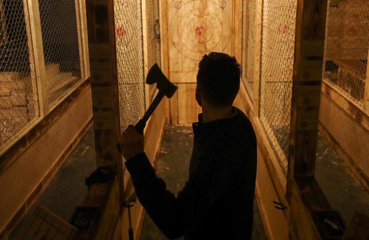 Trent Larkins throws an axe at Craft Axe Throwing in the vista. The new business opens this week.