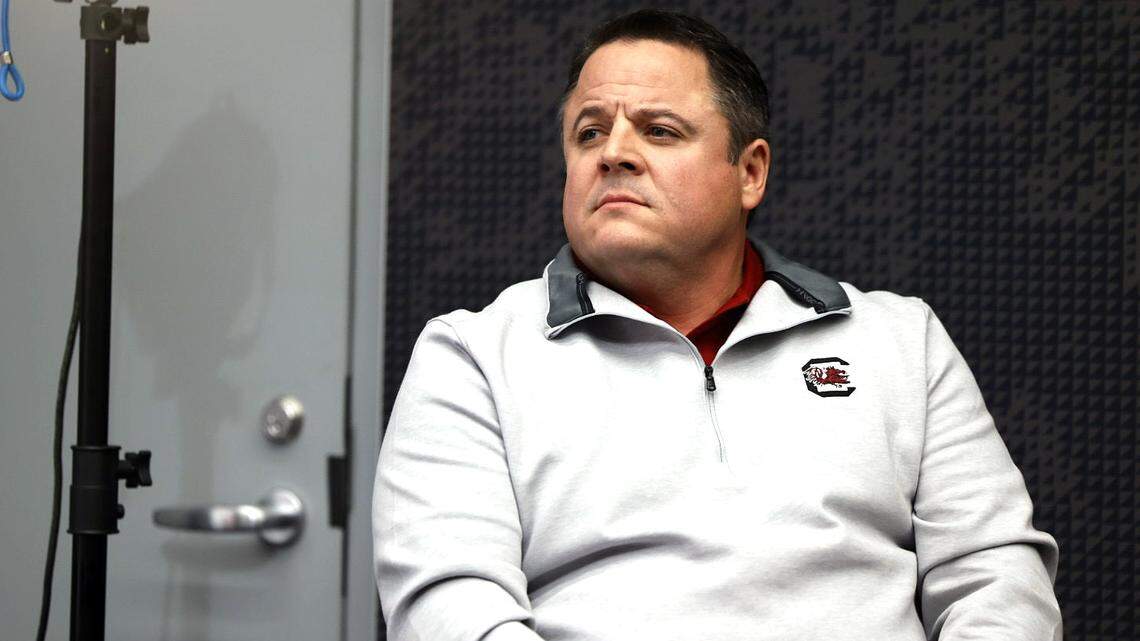 Dowell Loggains looks on Wednesday as Shane Beamer discusses his hire as South Carolina’s offensive coordinator.