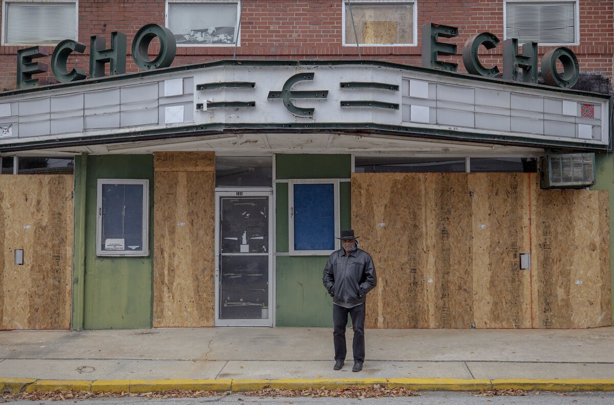 Rev. David Kennedy stands in front of the closed Redneck Shop Friday in Laurens. Kennedy hopes to transform the space to benefit the community. The Redneck Shop once sold KKK robes and swastikas and hosted neo-Nazi meetings before closing in the early 2000s.