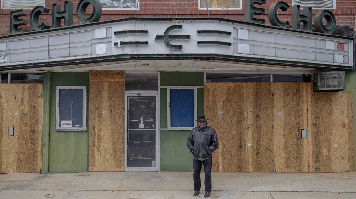 Rev. David Kennedy stands in front of the closed Redneck Shop Friday in Laurens. Kennedy hopes to transform the space to benefit the community. The Redneck Shop once sold KKK robes and swastikas and hosted neo-Nazi meetings before closing in the early 2000s.