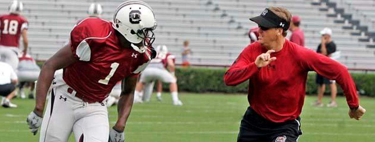 South Carolina WR Alshon Jeffery (1) is guarded by coach Steve Spurrier Jr. as he runs routes during the Gamecocks’ practice and scrimmage at Williams-Brice Stadium, Saturday, August 21, 2010.