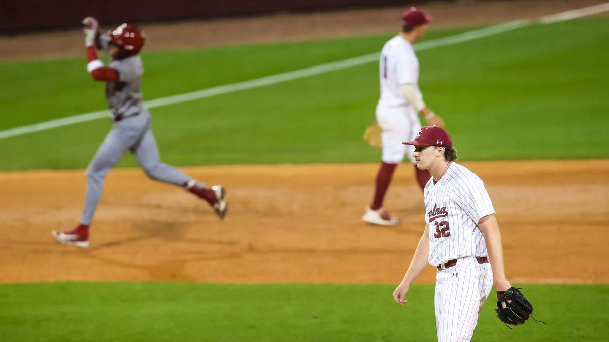 South Carolina Gamecocks pitcher Brandon Stone (32) reacts as Oklahoma Sooners outfielder Dasan Harris (17) rounds the bases on a solo home run during their game at Founders Park, 3/14/25.