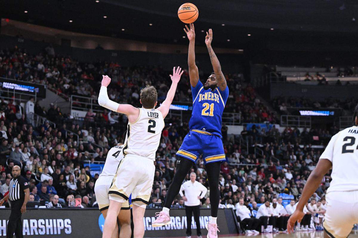 Mar 22, 2025; Providence, RI, USA; McNeese State Cowboys guard Sincere Parker (21) shoots against Purdue Boilermakers guard Fletcher Loyer (2) during the second half of a second round men’s NCAA Tournament game at Amica Mutual Pavilion.