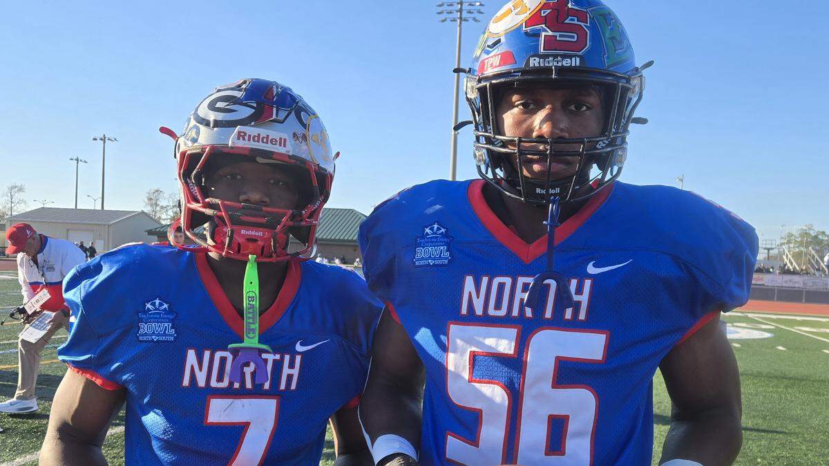 South Pointe running back RJ Brown, left, and Indian Land’s Michael Foster earned MVP honors for the North team in the 2025 Touchstone Energy Bowl at Doug Shaw Stadium in Myrtle Beach.