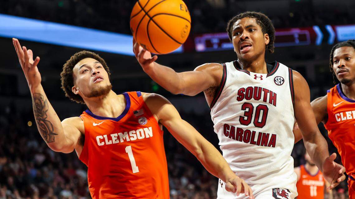 South Carolina Gamecocks forward Collin Murray-Boyles (30) grabs a rebound in front of Clemson Tigers guard Chase Hunter (1) in the first half at Colonial Life Arena.