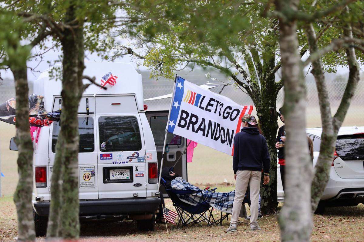 Supporters gather hours ahead of former President Donald Trump’s rally in Florence, S.C., on Saturday, March 12, 2022.