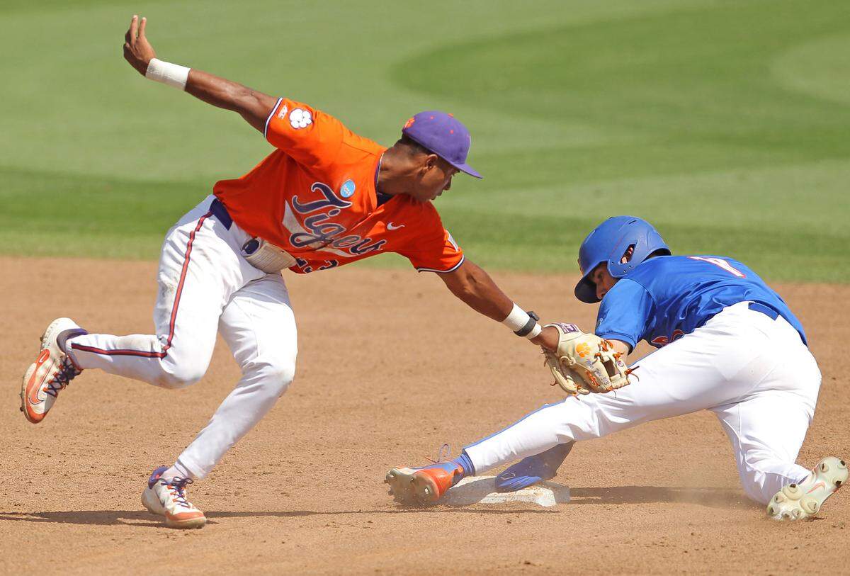 Clemson’s Jarren Purify is too late as Florida’s Michael Robertson is safe at second during NCAA Super Regionals action on Saturday, June 8, 2024 in Clemson, S.C.