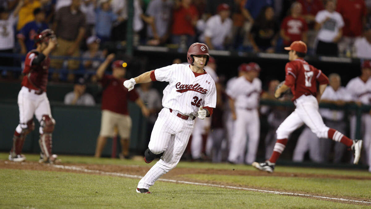From June 2010: USC’s Brady Thomas heads to first on his game winning hit in the 12th inning to beat Oklahoma 3-2 during the 2010 College World Series at Rosenblatt Stadium in Omaha.