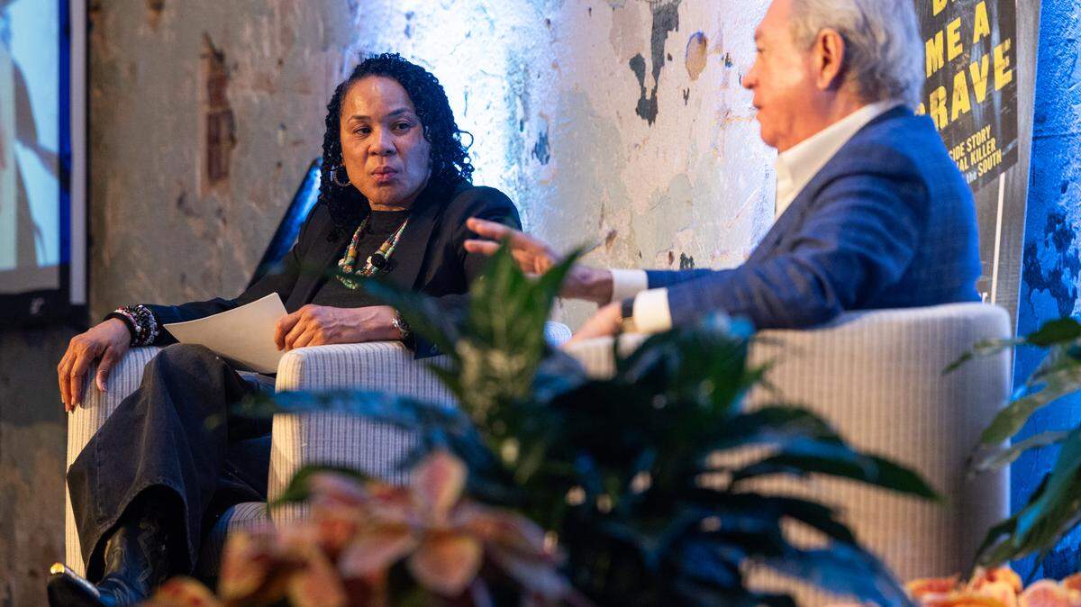 USC basketball coach Dawn Staley, a true crime fan, quizzes legal lion Dick Harpootlian on his book about serial killer Pee Wee Gaskins. 
