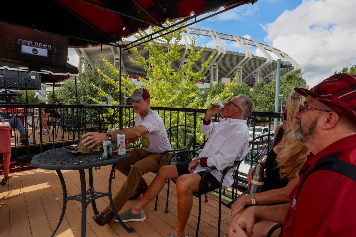 Steve Clary, from left, Tom Davant, Kim Devant and Paul Eskridge watch the USC football game against LSU from the balcony of a Cockaboose on Saturday, Sept. 14, 2024. Tom Davant said he had not been inside the stadium to watch a game in six years.