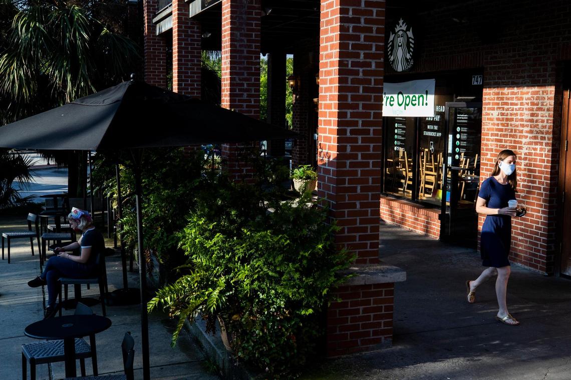 Customers leave Starbucks in Five Points wearing masks on Friday, June 26, 2020. Columbia made masks mandatory in public for all those that can wear one Friday morning.
