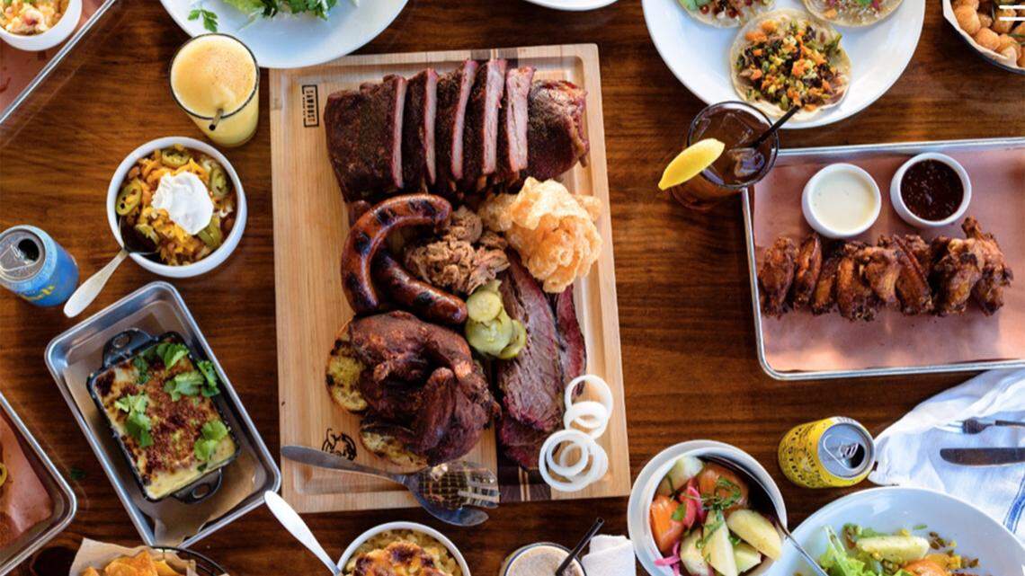A spread from Home Team BBQ. The restaurant has opened in the old Harper’s location in Five Points.