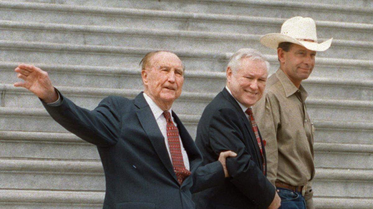 U.S. Sen. Strom Thurmond of South Carolina arrives to sign an estate tax repeal bill on the steps of the U.S. Capitol on Aug. 24, 2000. Thurmond is accompanied by chief of staff Duke Short and a Montana cattle rancher, Lynn Cornwell.