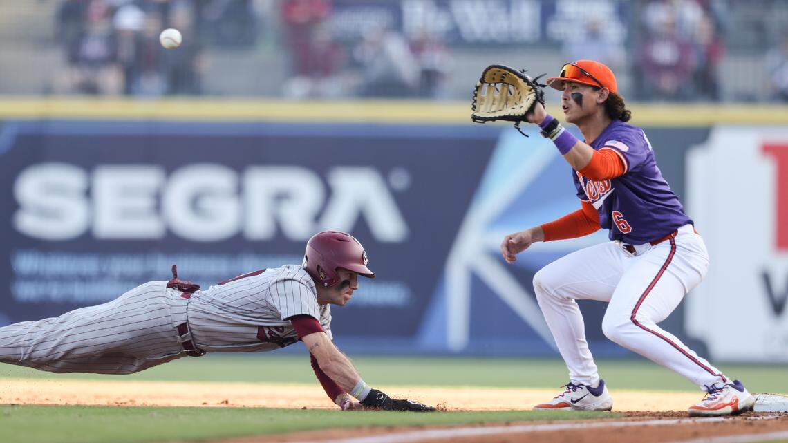 South Carolina outfielder Dylan Brewer (10) dives safely back into first base, ahead of the tag by Clemson infielder Jacob Hinderleider (6) during the Gamecocks’ game against Clemson at Segra Park in Columbia on Saturday, March 2, 2024.