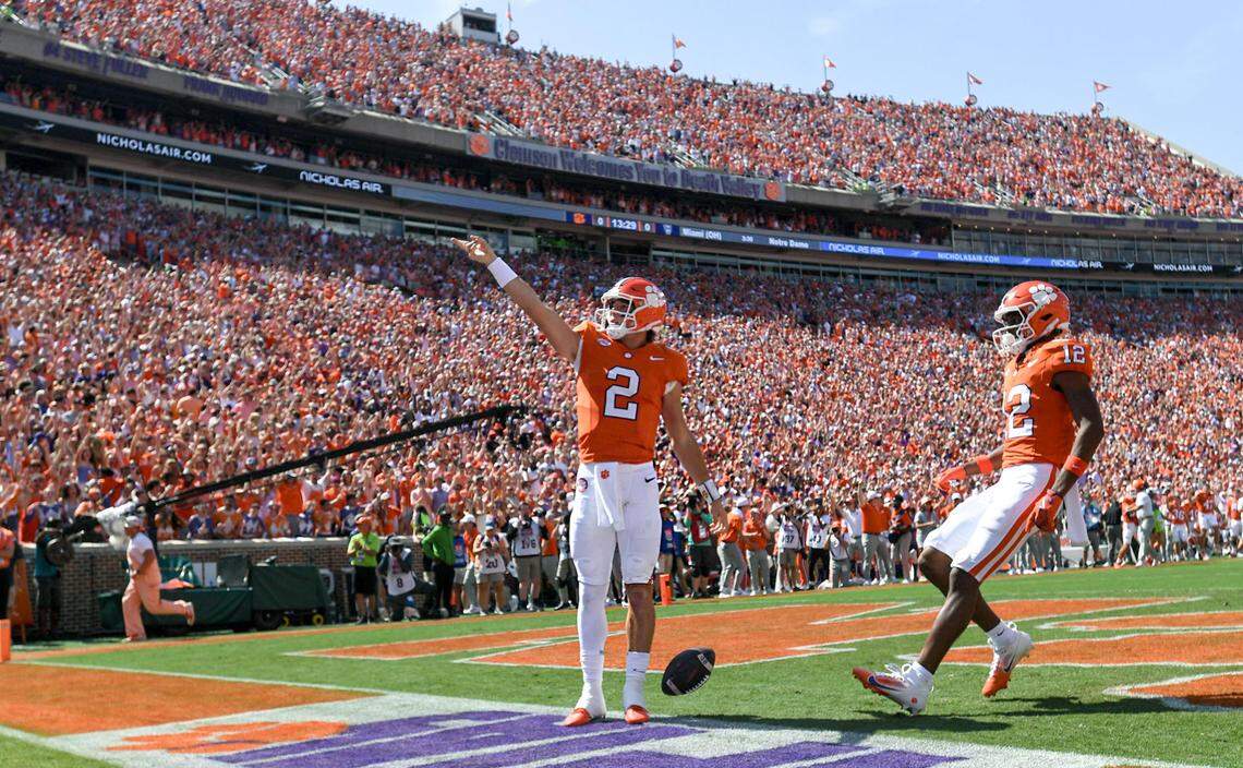 Sep 21, 2024; Clemson, South Carolina, USA; Clemson Tigers quarterback Cade Klubnik (2) waves to the crowd after running in for a touchdown against the North Carolina State Wolfpack at Memorial Stadium.