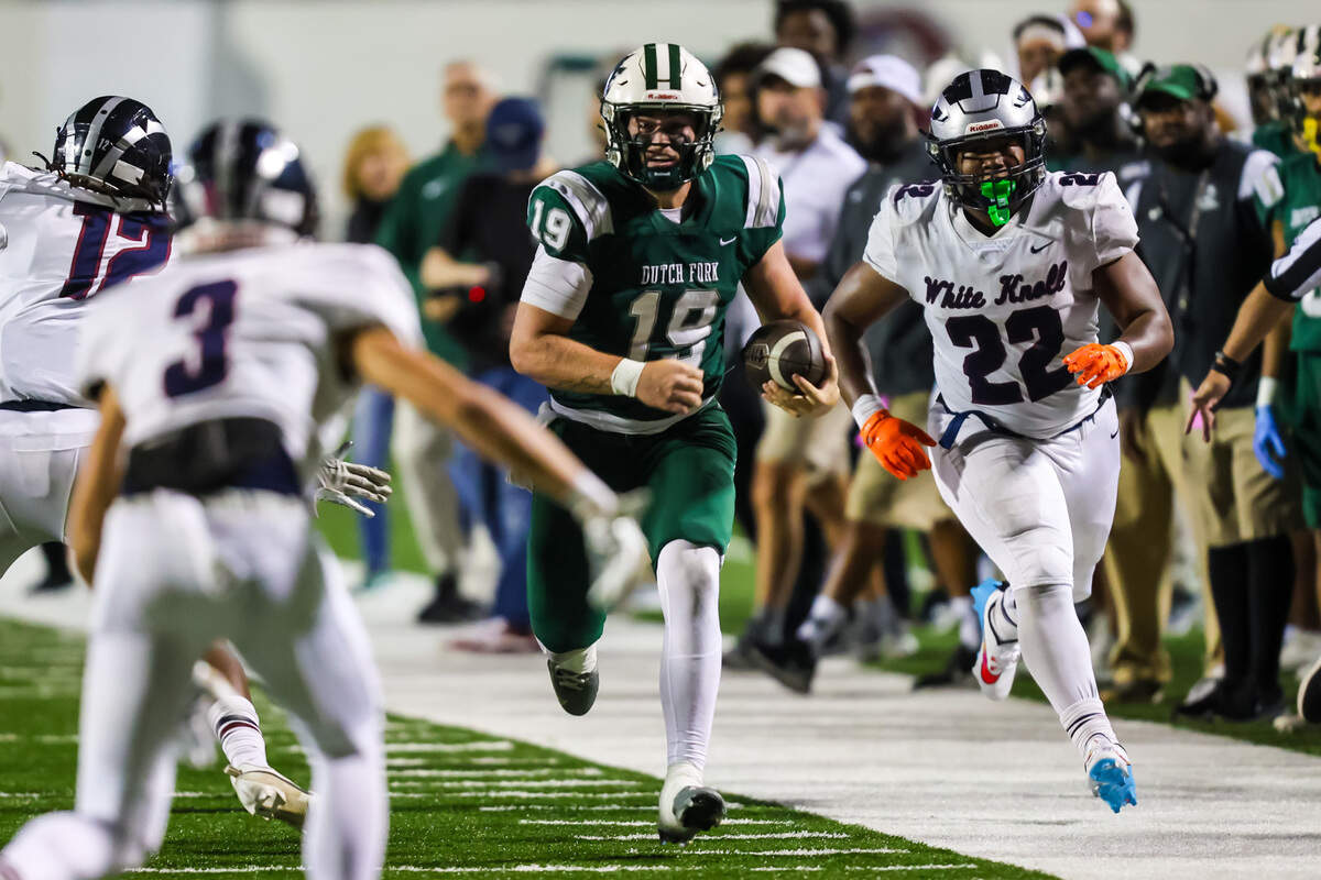 Dutch Fork Silver Foxes Jonathan Hunt (19) rushes for a long gain against the White Knoll Timberwolves during the 5A State Championship Game Friday, Dec. 1, 2023, at South Carolina State’s Oliver Dawson Stadium in Orangeburg, SC.