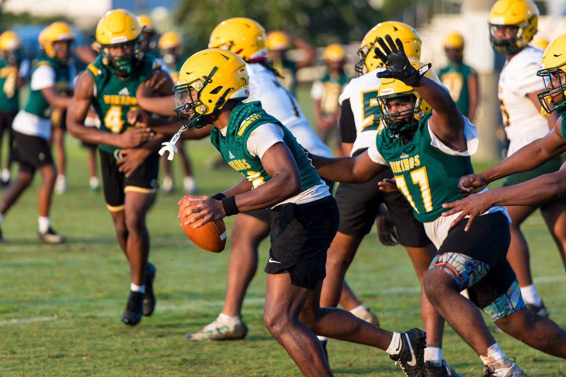 Spring Valley QB Dylan Redden scrambles during practice.