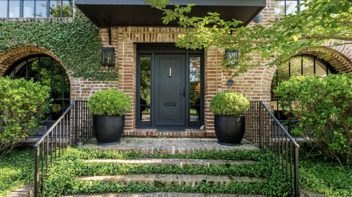 The street in front of the Adger’s Wharf home is made of cobblestone.