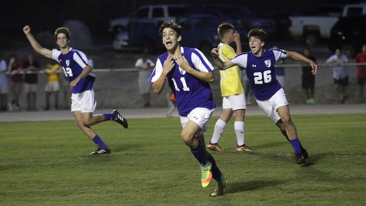 Hammond’s Luca Al-Habash (11) celebrates his go-ahead goal in the second half of the SCISA soccer state championship win over Cardinal Newman on Saturday. It was later scored as an own goal after the match. 5/12/18