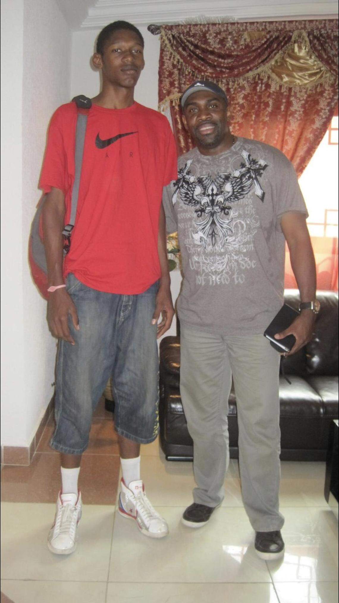 A young Chris Silva poses with Joe Touomou in 2011. Touomou, a player development coach for NBA Academy Africa, discovered and brought Silva to America from Gabon, Africa.